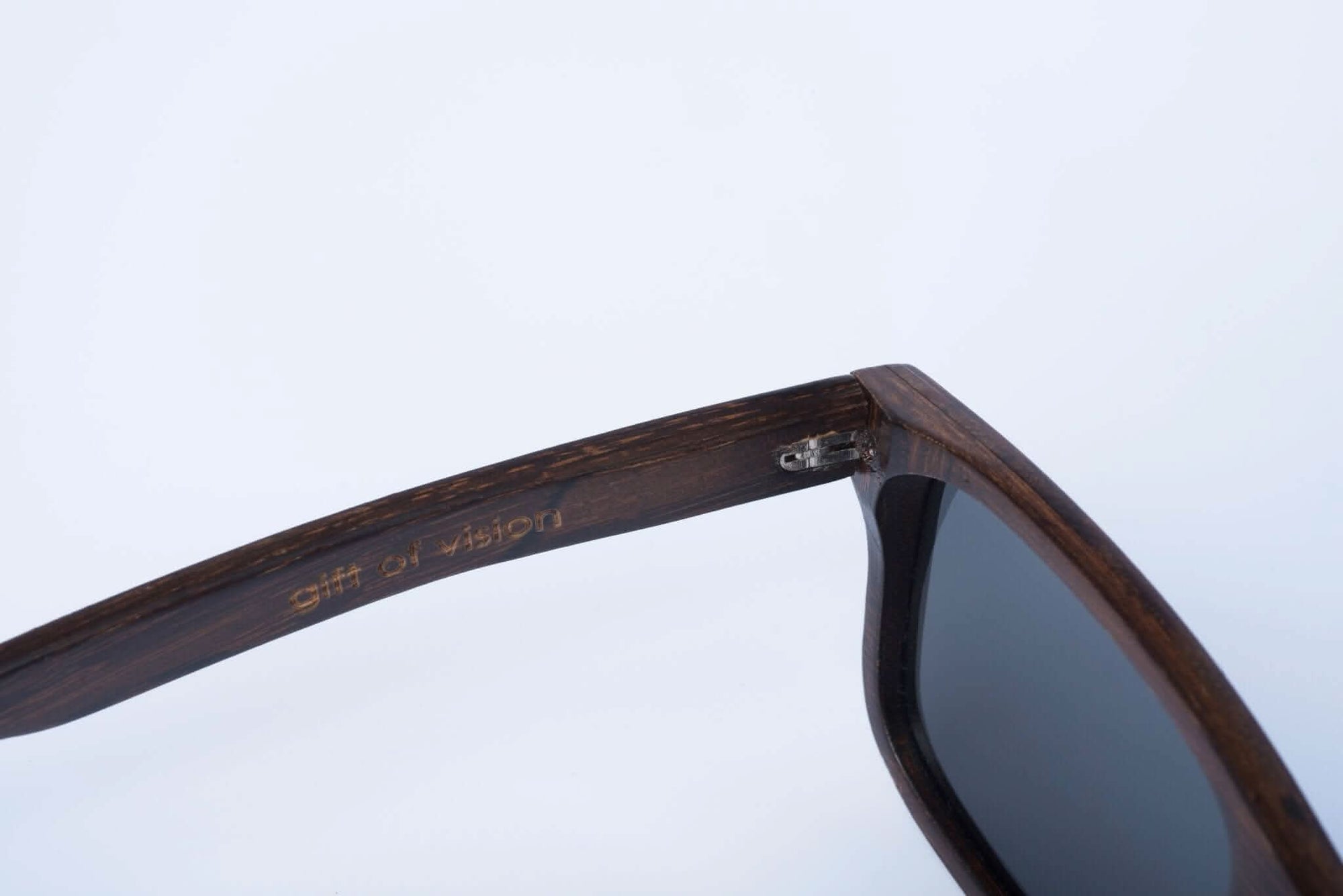 Panda CARVER Bamboo Wayfarer Sunglasses (Brown) Inside Left Arm View with &quot;gift of vision&quot; Embossed