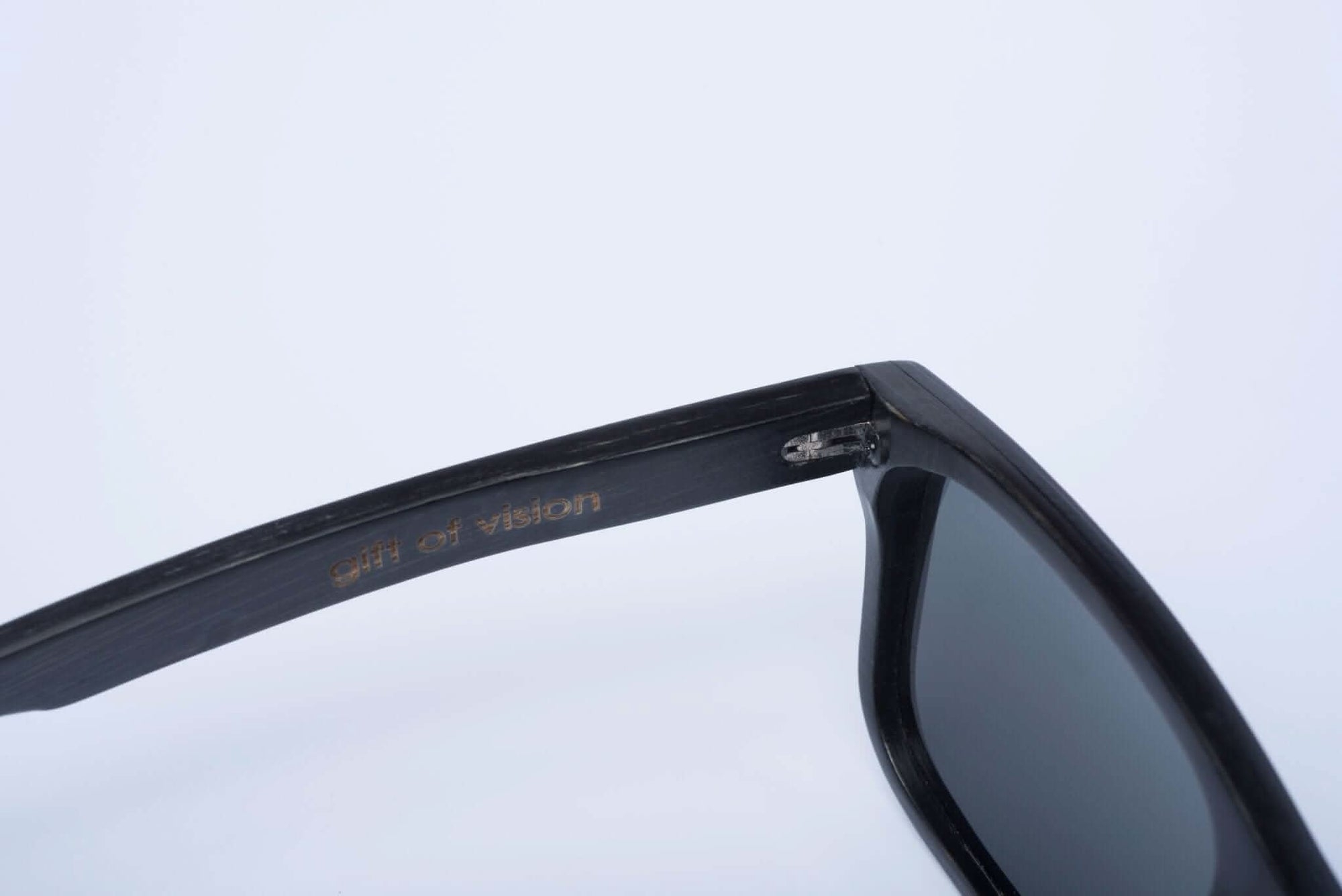 Panda CARVER Bamboo Wayfarer Sunglasses (Black) Inside Left Arm View with "gift of vision" Embossed