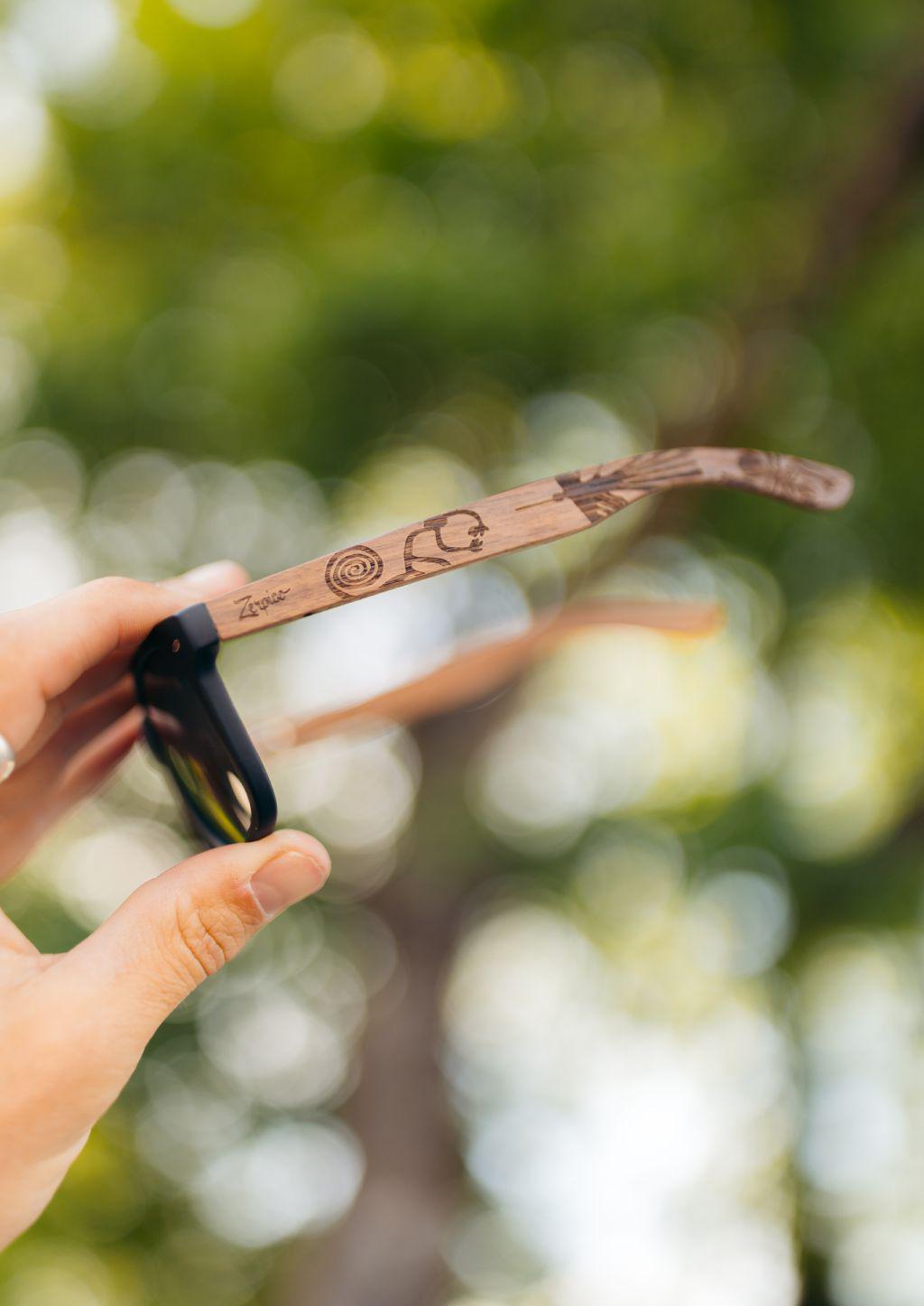 Zerpico NATIVE Eyewood Engraved Wooden Sunglasses - In-Hand View 1 Highlighting Hand-Carved Wooden Arms