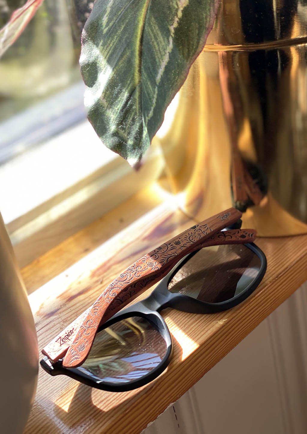 Zerpico OASIS Eyewood Engraved Wooden Sunglasses - Lifestyle Folded View Highlighting Hand-Carved Wooden Arms