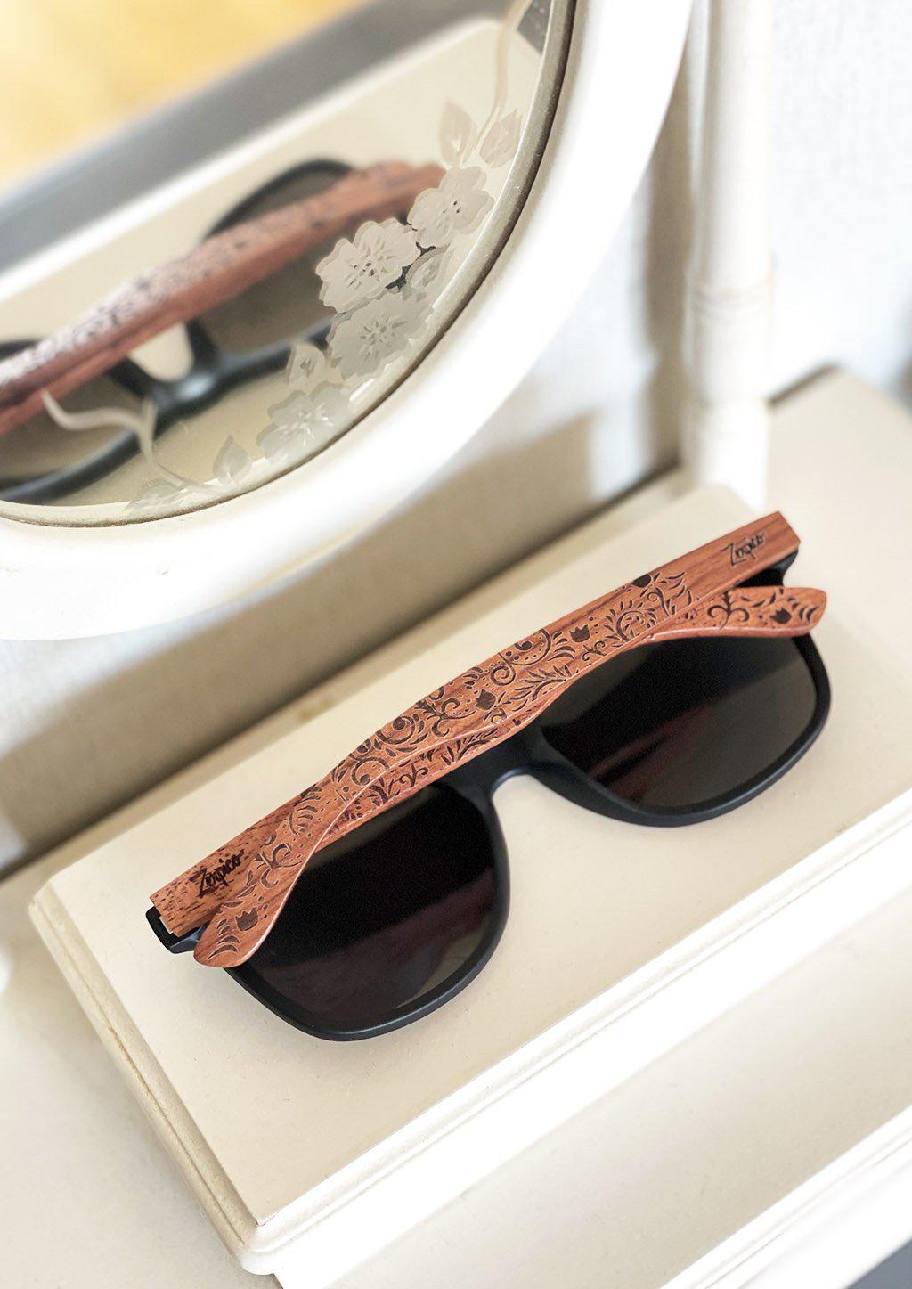 Zerpico OASIS Eyewood Engraved Wooden Sunglasses - Lifestyle Folded View on White Vanity Highlighting Hand-Carved Wooden Arms