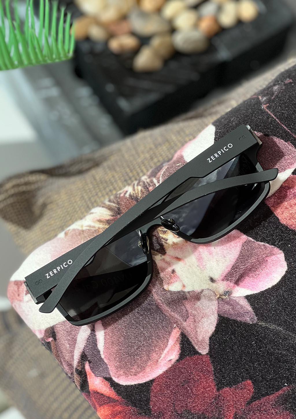 Zerpico ReVision Square Eco-Friendly Recycled Paper Sunglasses - Model: Black Frame - Black/Grey Lens (Flat Lay View) available at SOLEVYN