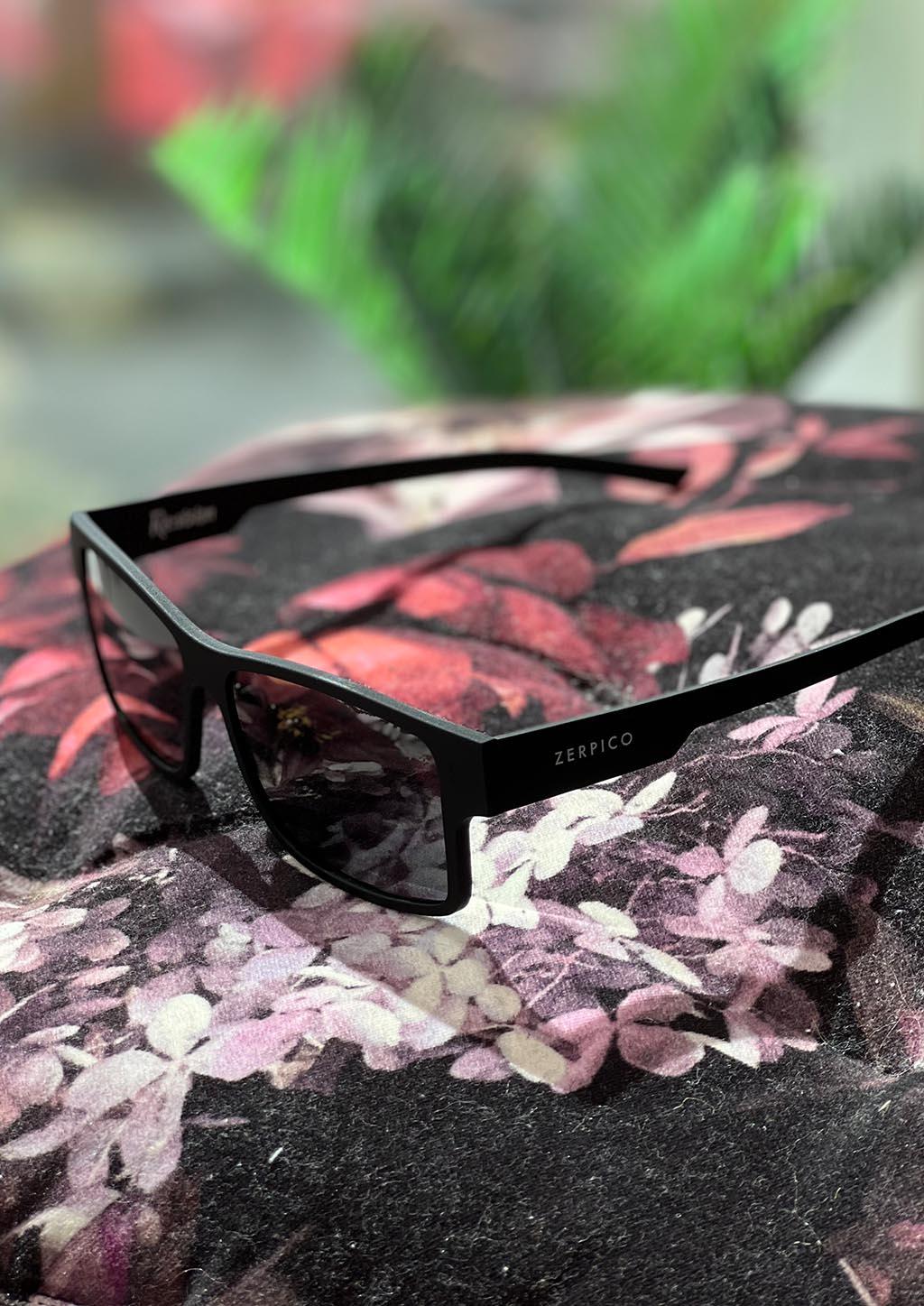 Zerpico ReVision Square Eco-Friendly Recycled Paper Sunglasses - Model: Black Frame - Photochromic Black/Grey Lens (Outdoor Angled View) available at SOLEVYN